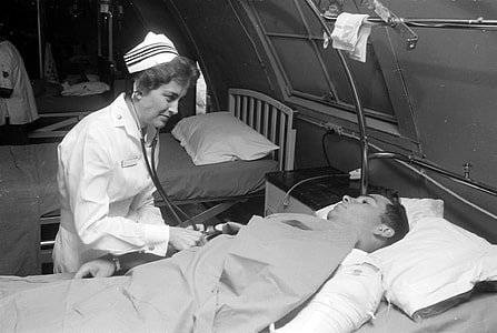 Nurse Treating Soldier in Hospital during the Vietnam War thumbnail