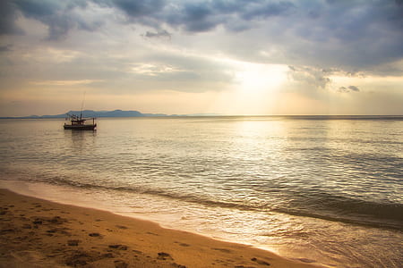 boat sailing in sea during sunset thumbnail