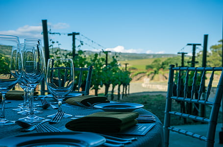 clear wine glasses beside plate on table thumbnail
