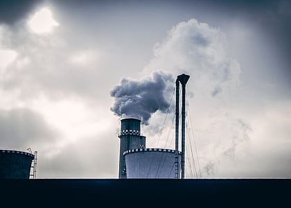 smoke coming out of chimney during daytime thumbnail