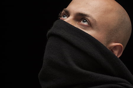 man wearing black neck warmer thumbnail