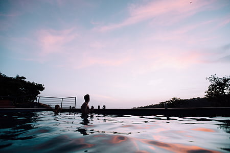 man surrounded by water during daytime thumbnail