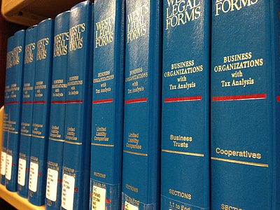 close-up photo of pile of books on shelf thumbnail