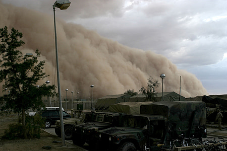 large brown smoke on military camp during dayime thumbnail