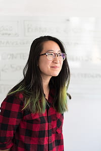 Shallow Focus Photography of a Woman in Red and Black Checkered Dress Shirt thumbnail