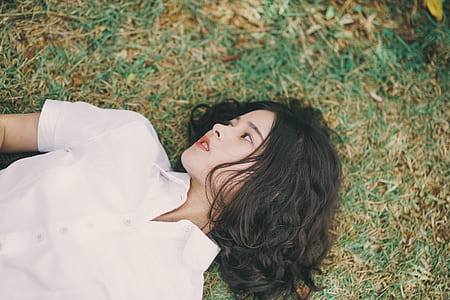 woman laying on grass thumbnail