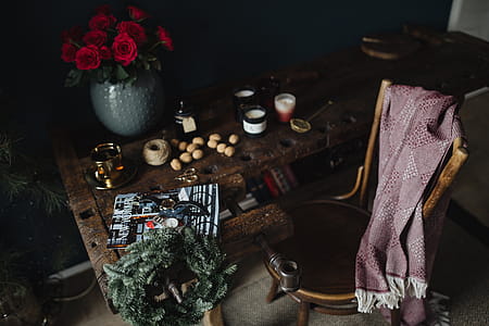 New Yorker, some nuts, watches, and other things on the old, wooden table thumbnail