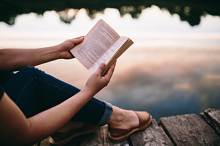 Reading book at lake thumbnail