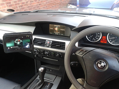 BMW vehicle parked beside brick wall thumbnail