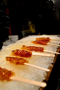 closeup meat skewers on top of crushed ice thumbnail