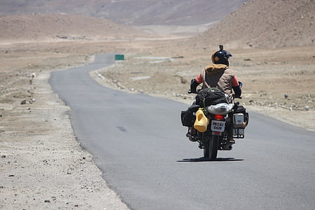 person driving motorcycle at road thumbnail