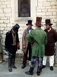 four men wearing coats thumbnail