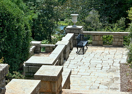 empty bench beside concrete hand rail thumbnail