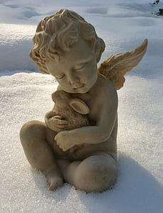 cherub holding rodent statue thumbnail
