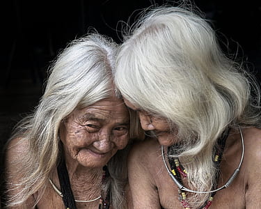 two women wearing necklaces thumbnail