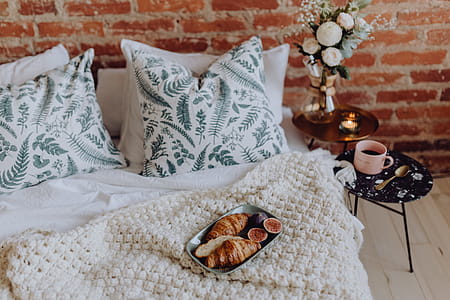 A lovely woman's bedroom with a beautiful bouquet of flowers thumbnail