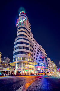 white painted building during nighttime thumbnail