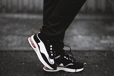 Person Wearing Pair of Black-and-white Runnning Shoes thumbnail