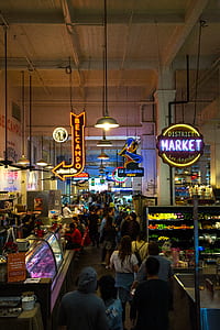 group of people walking inside market store thumbnail