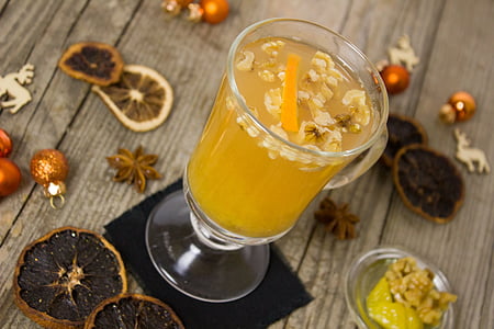 clear hurricane glass beside fruits thumbnail