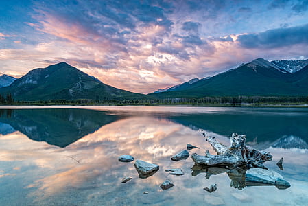 body of water near mountains thumbnail