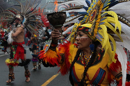 woman in yellow and orange traditional costume at the parade thumbnail