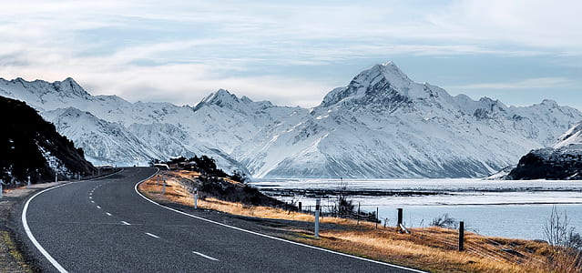 mountain near body of water during daytime thumbnail