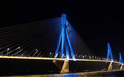 white and blue bridge with lights during nighttime thumbnail