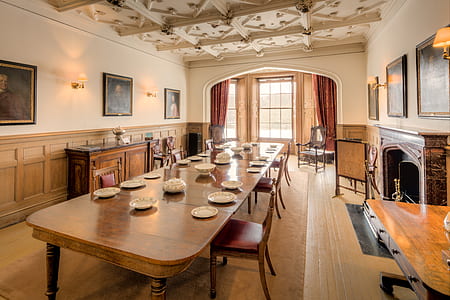 rectangular brown wooden dining table inside house thumbnail