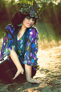 fashion photography of woman sitting on sand thumbnail