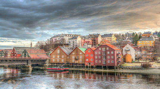 city buildings beside body of water at daytime thumbnail