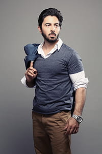 Man Holding Coat on Shoulder thumbnail