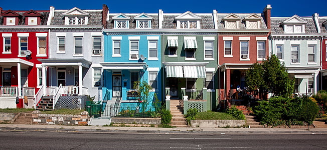 white, red, gray, and blue painted buildings thumbnail