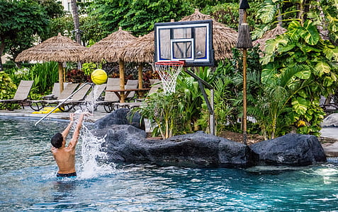 person throwing ball in body of water thumbnail