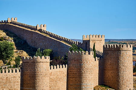 brown concrete castle under clear blue sky during daytime thumbnail