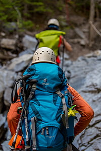 persons in gray helmet hiking thumbnail