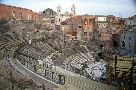 The Church of Saint Francis of Assisi backs the Cavea of the Greek-Roman Theatre in Catania, Italy thumbnail