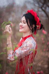selective focus photography of woman wearing red dress thumbnail
