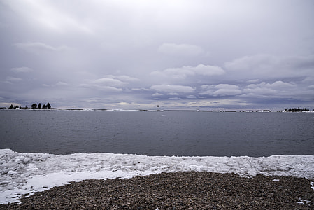 Winter landscape and sky of Lake Superior Inlet, Grand Marais, Minnesota thumbnail