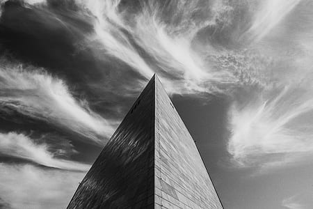 low angle grayscale photography of high-rise building thumbnail