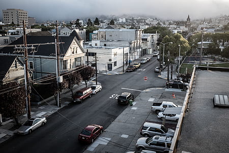 bird's-eye view of asphalt road between city houses thumbnail