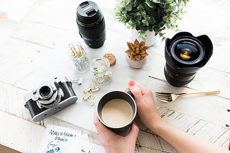 person holding black mug filled with coffee thumbnail