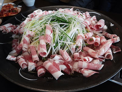bacon strips on cooking pan thumbnail