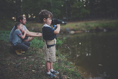 boy in black shirt and brown shorts thumbnail