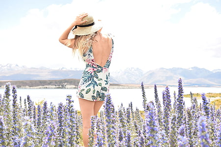 woman wearing floral backless dress surrounded by lavender flowers thumbnail