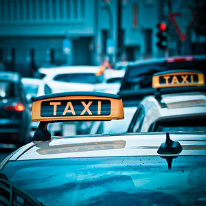 silver taxi cabs on road during daytime thumbnail