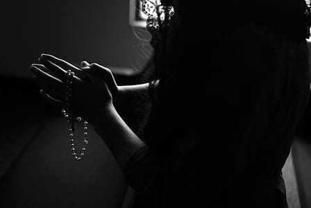 woman praying in the room thumbnail