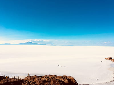people walking on vast snow-covered plain thumbnail