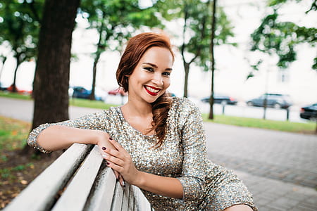 woman in gray dress siting on bench thumbnail
