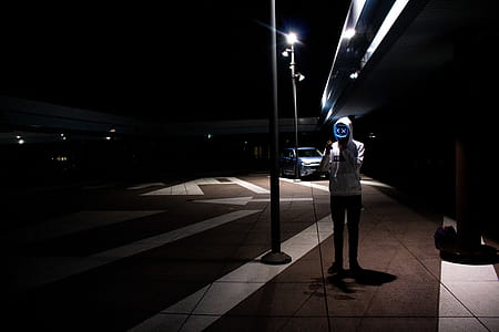 Man Wearing Hoodie Near Post thumbnail
